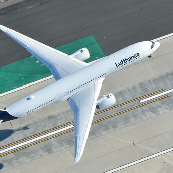Lufthansa aircraft taxiing on airport runway