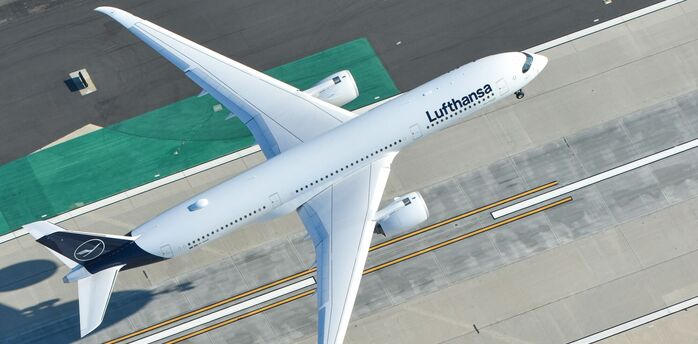 Lufthansa aircraft taxiing on airport runway