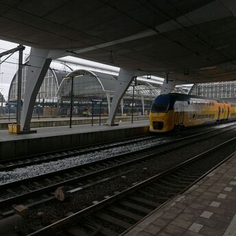 Dutch double-decker train at modern station platform