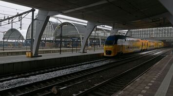 Dutch double-decker train at modern station platform