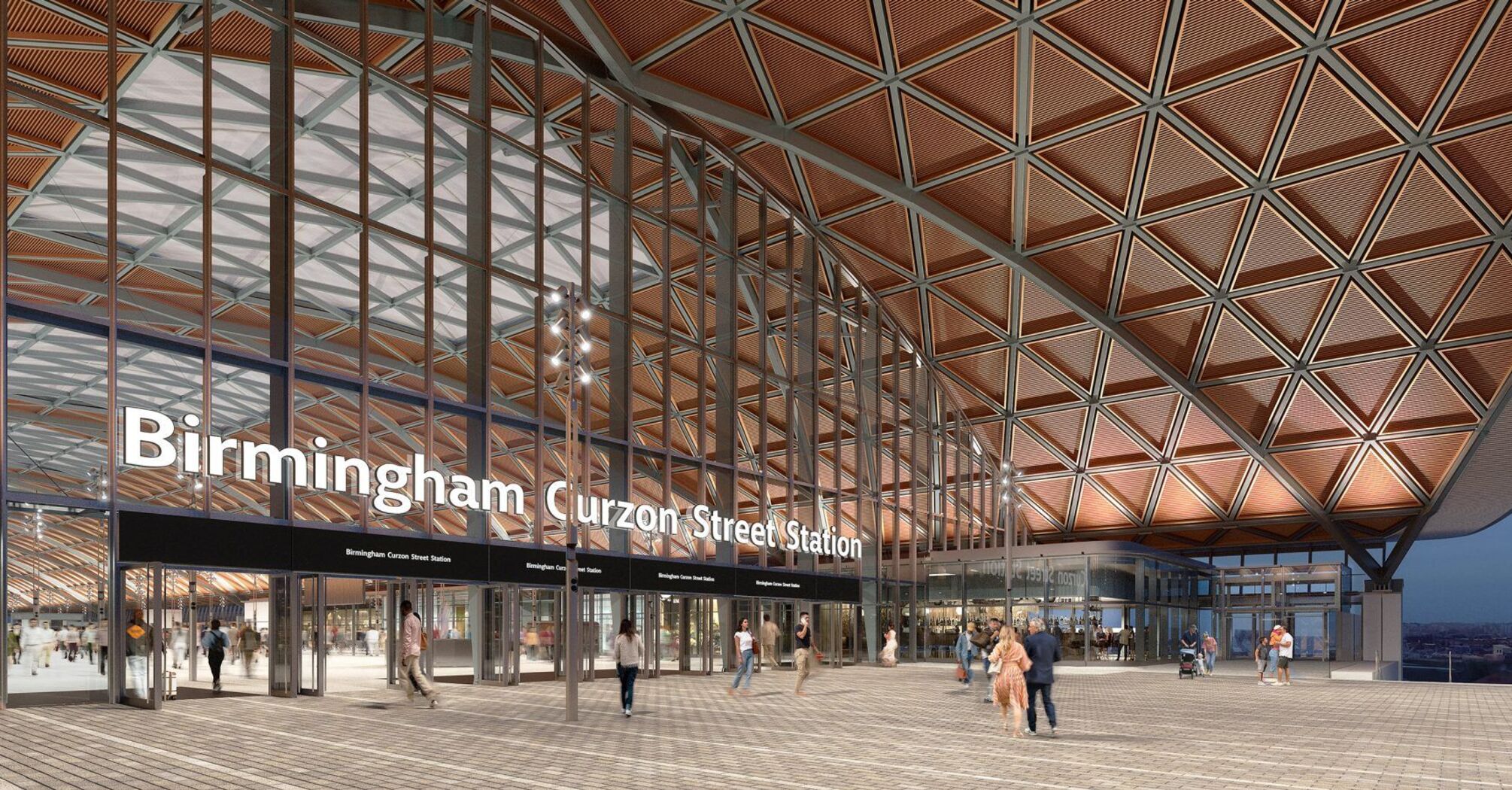 Main entrance of Birmingham Curzon Street Station with glass façade and public square