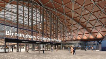 Main entrance of Birmingham Curzon Street Station with glass façade and public square