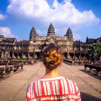 Woman looking at Angkor Wat temple in Asia