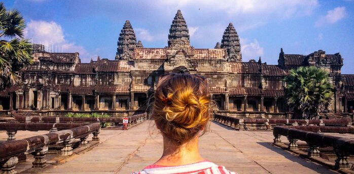 Woman looking at Angkor Wat temple in Asia