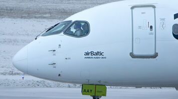 airBaltic Airbus A220-300 aircraft on snowy runway
