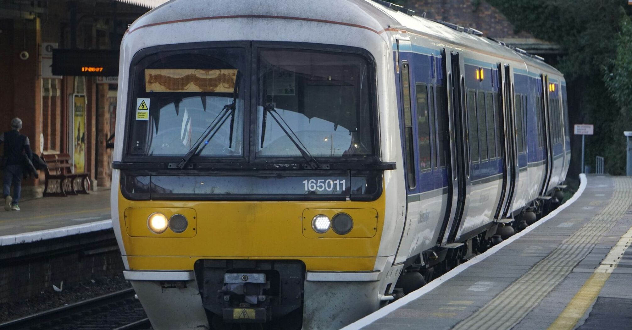 UK passenger train at station platform