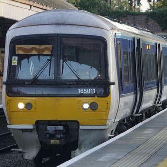 UK passenger train at station platform
