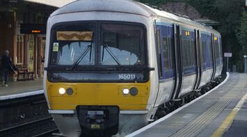 UK passenger train at station platform