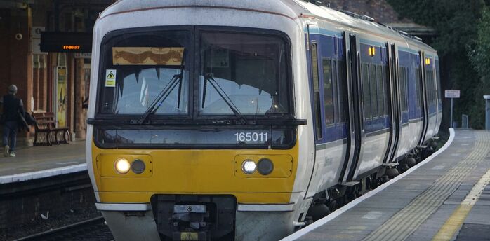 UK passenger train at station platform