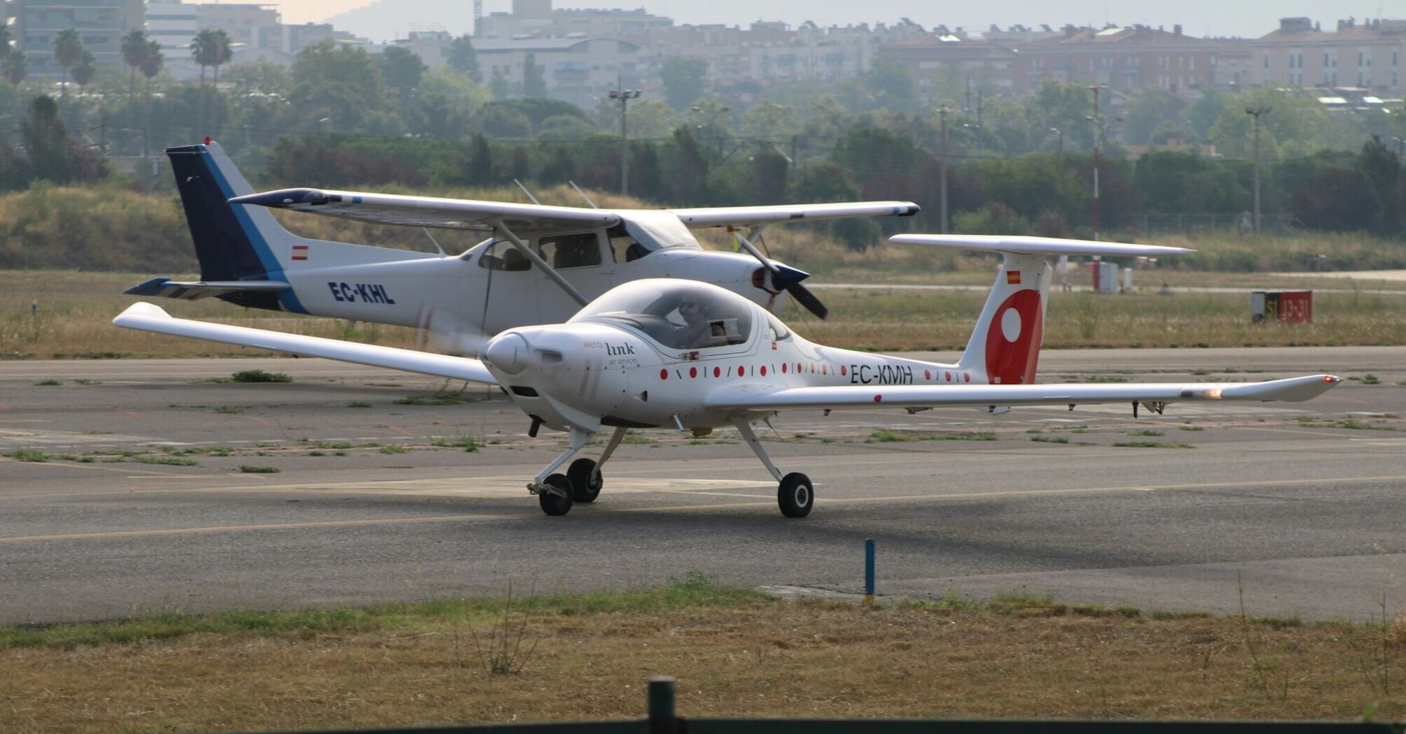 Small electric aircraft on airport runway