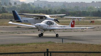 Small electric aircraft on airport runway