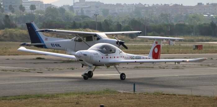 Small electric aircraft on airport runway