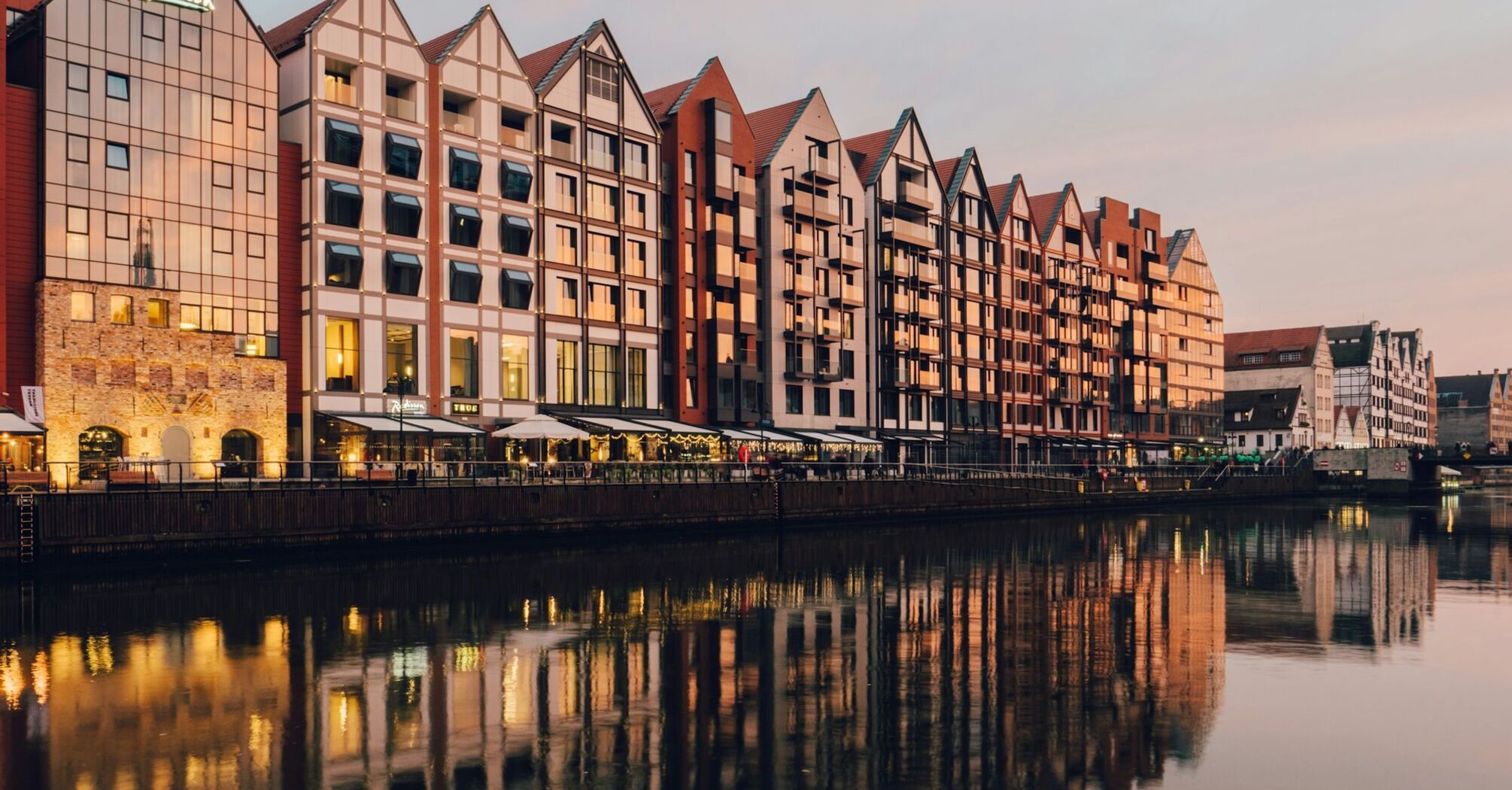Riverside buildings in Gdańsk at sunset