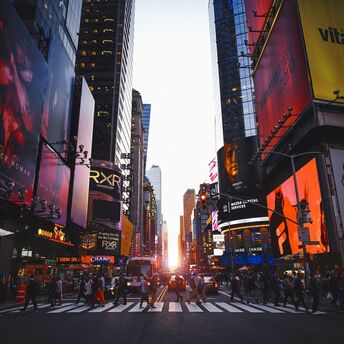Times Square street scene with bright digital billboards