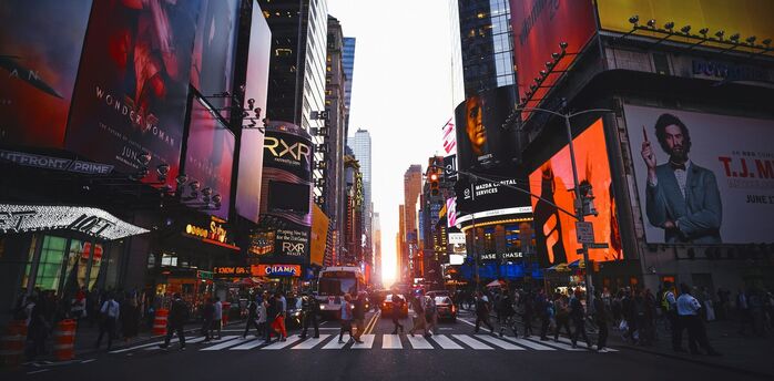 Times Square street scene with bright digital billboards