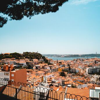 Lisbon cityscape with terracotta roofs and Tagus River view