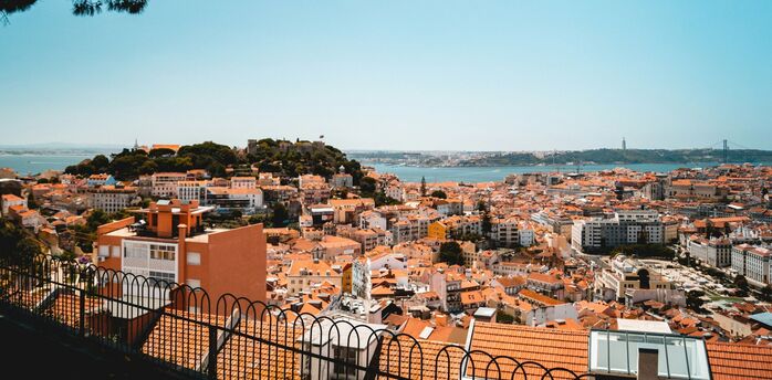 Lisbon cityscape with terracotta roofs and Tagus River view