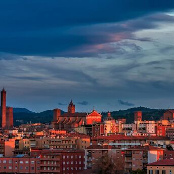 Bologna skyline with historic towers at sunset