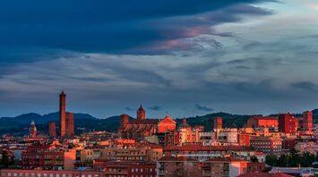 Bologna skyline with historic towers at sunset