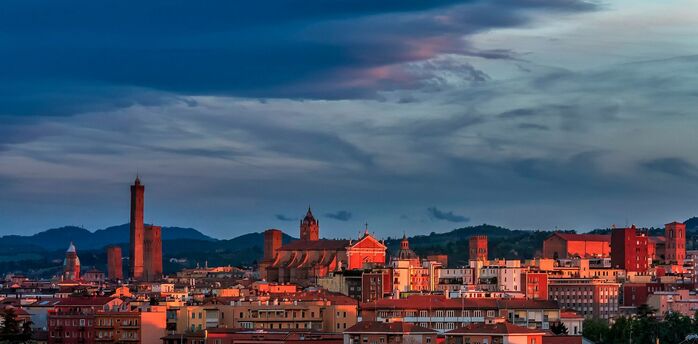 Bologna skyline with historic towers at sunset