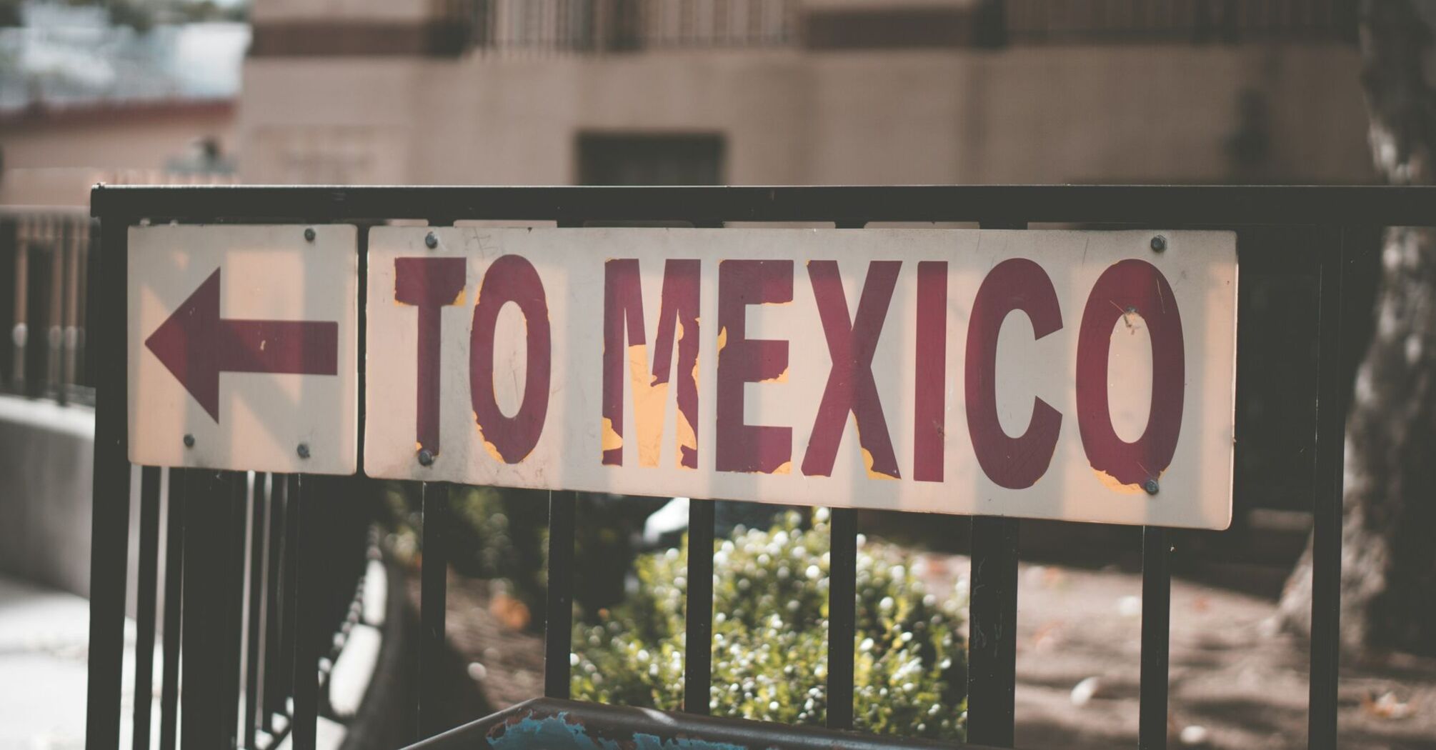 Street sign pointing toward Mexico direction
