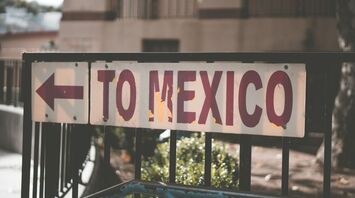 Street sign pointing toward Mexico direction