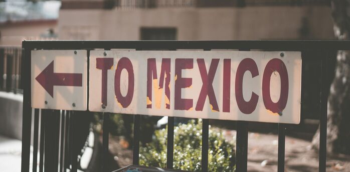 Street sign pointing toward Mexico direction