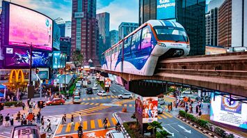 Kuala Lumpur city centre with Rapid KL monorail and busy intersection