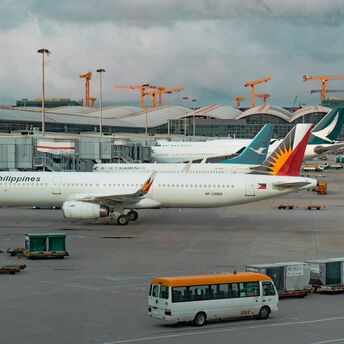 Philippine Airlines aircraft parked at an airport gate