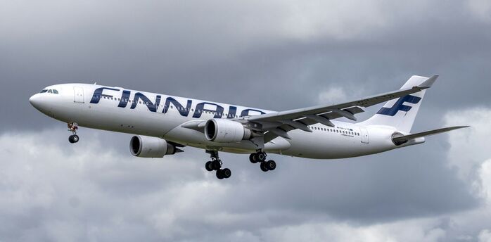 Finnair Airbus A330 aircraft approaching runway during landing