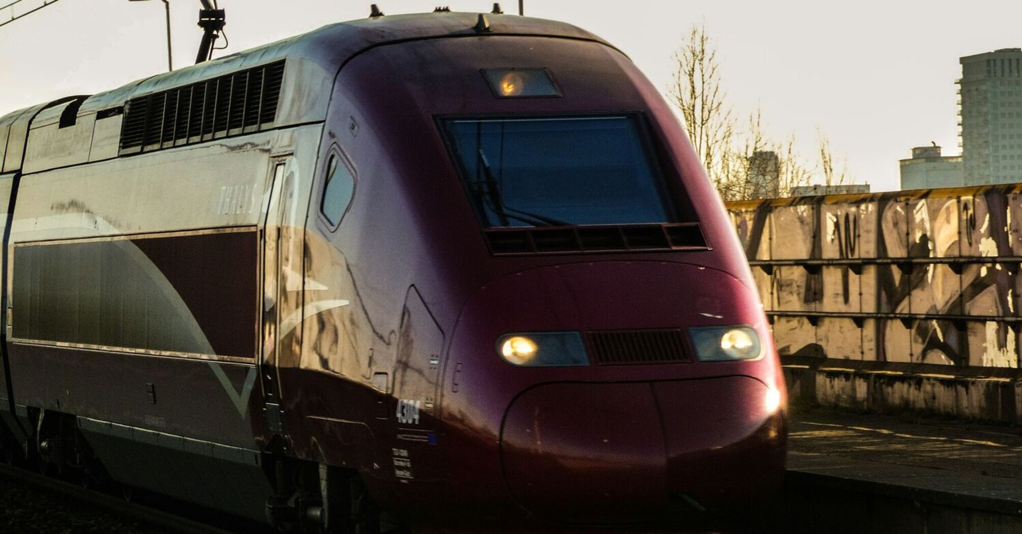 High-speed train travelling on electrified railway tracks