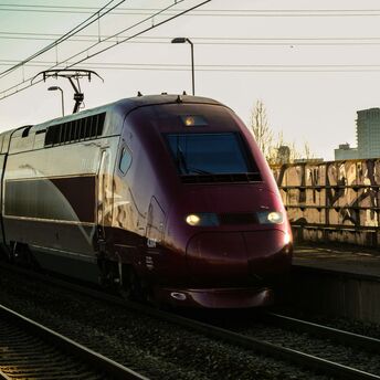 High-speed train travelling on electrified railway tracks