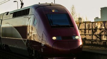 High-speed train travelling on electrified railway tracks