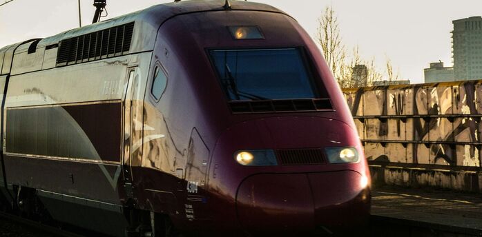 High-speed train travelling on electrified railway tracks