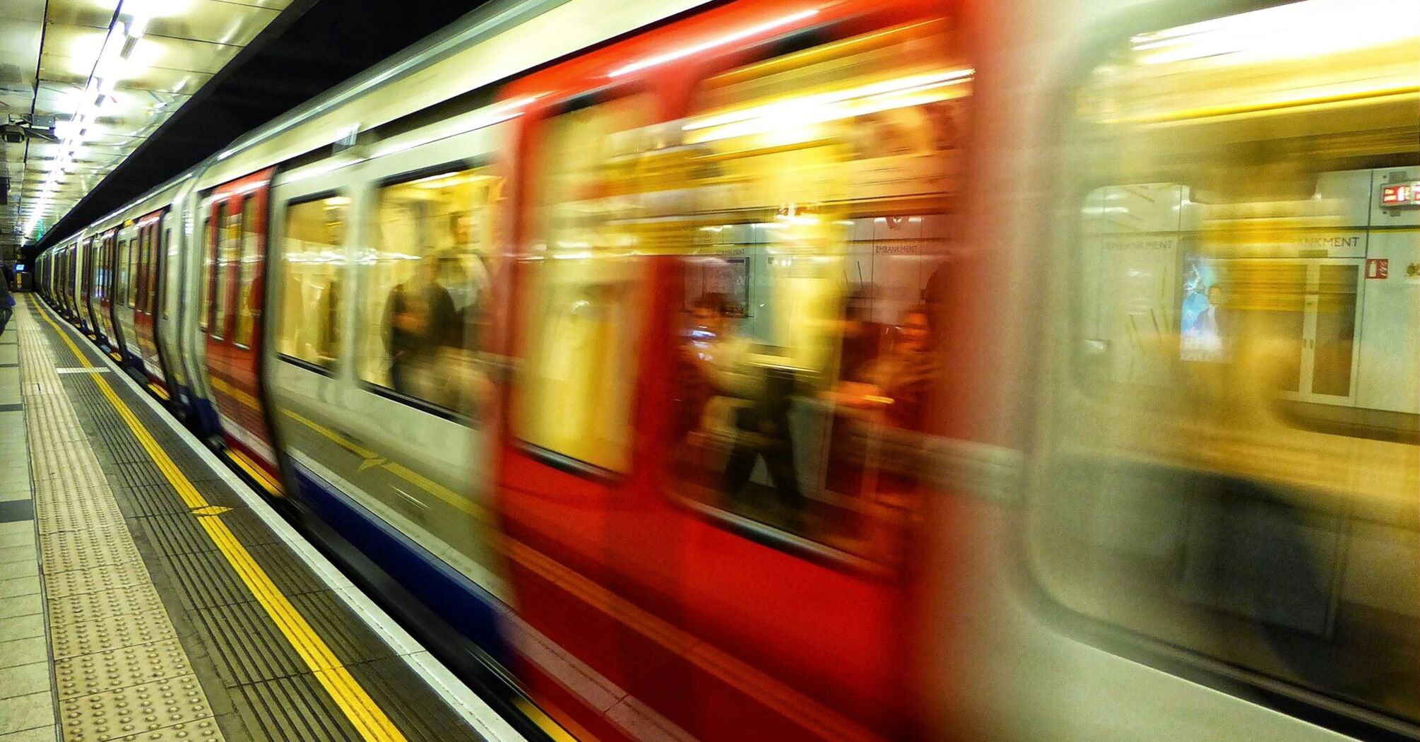 London Underground train arriving at platform