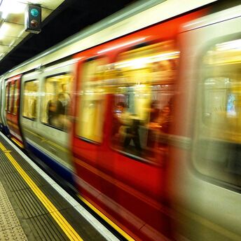 London Underground train arriving at platform