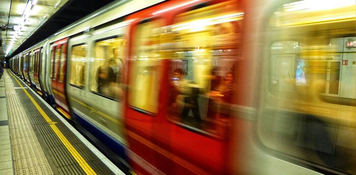 London Underground train arriving at platform