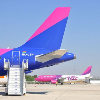Wizz Air aircraft parked on airport apron