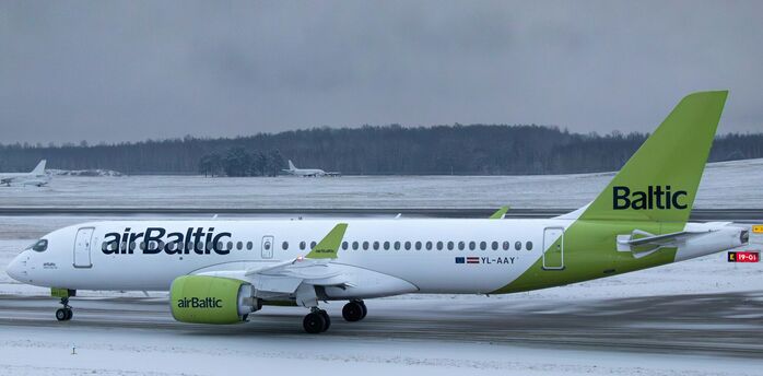 airBaltic Airbus A220 aircraft on snowy runway