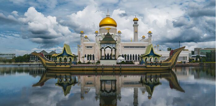 Sultan Omar Ali Saifuddien Mosque reflected in lagoon in Brunei