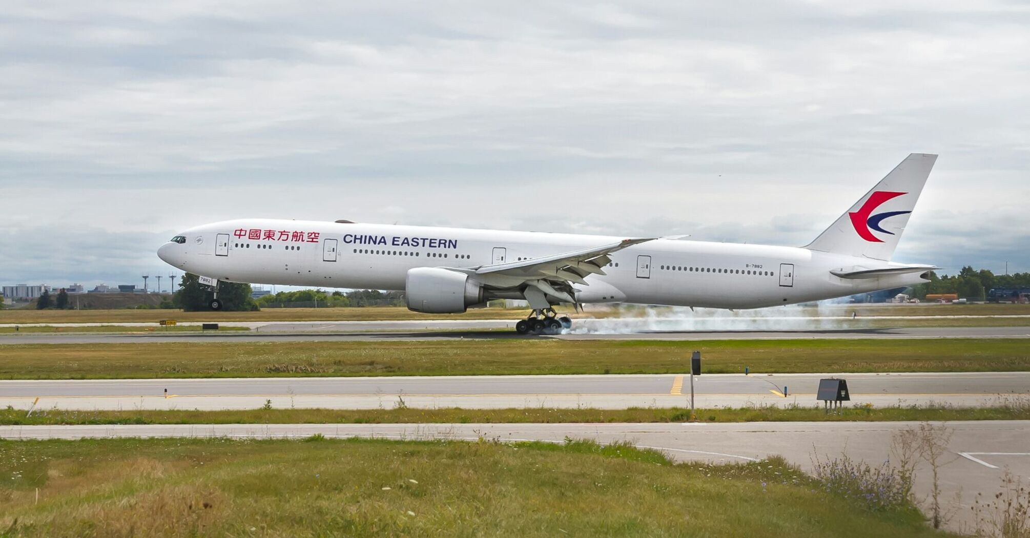 China Eastern widebody aircraft landing on airport runway