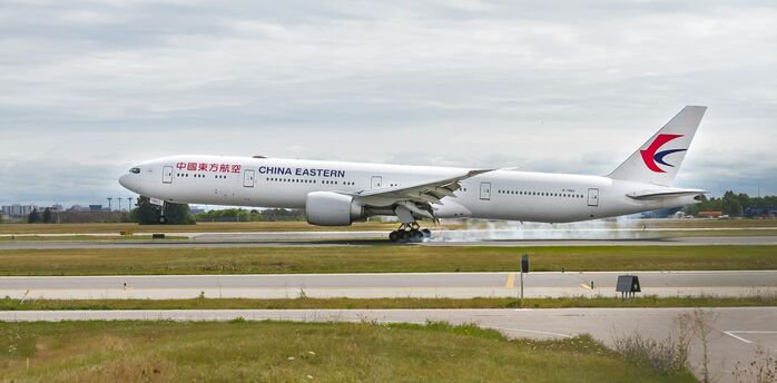 China Eastern widebody aircraft landing on airport runway