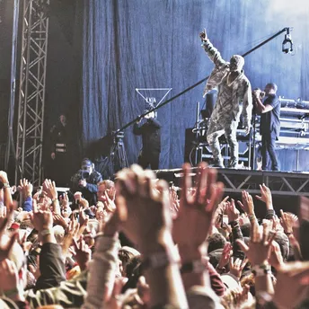 Kanye West performing on stage at music festival