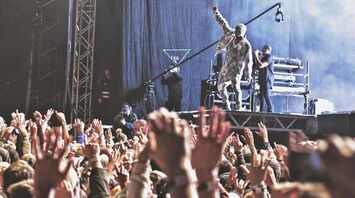 Kanye West performing on stage at music festival