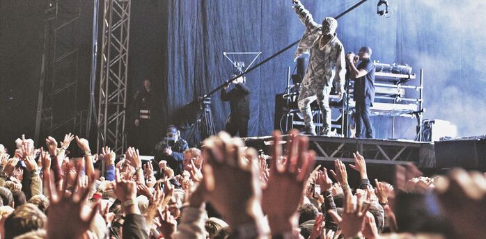 Kanye West performing on stage at music festival