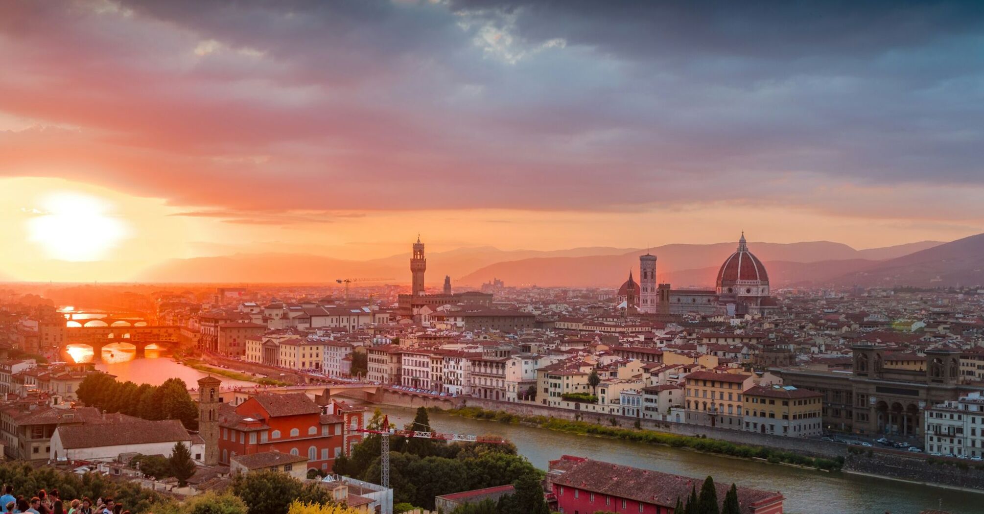 Florence skyline at sunset with Duomo and Arno River