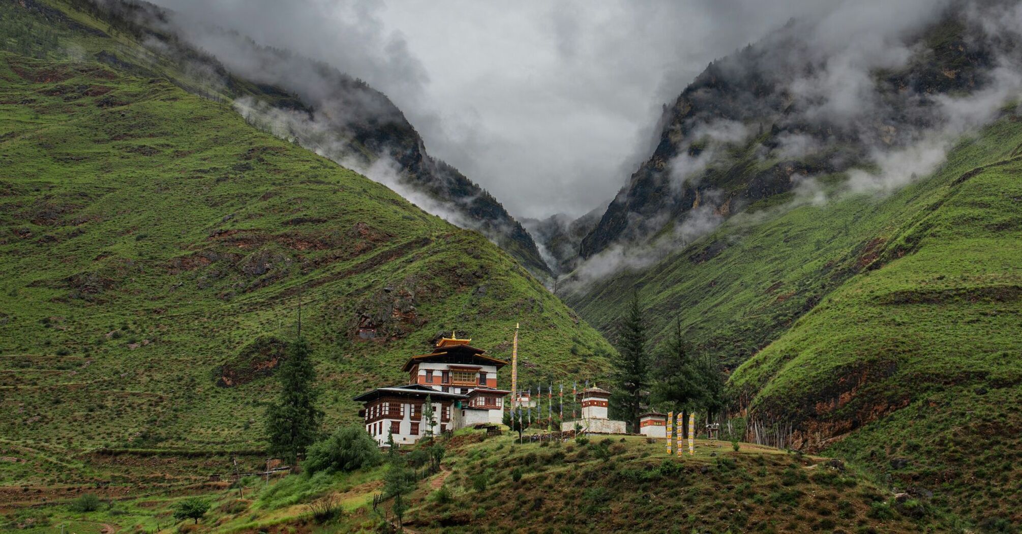 Bhutan mountain valley with traditional monastery buildings