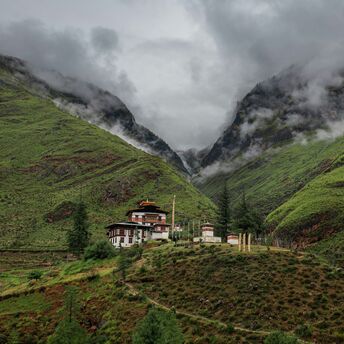 Bhutan mountain valley with traditional monastery buildings