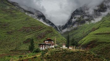 Bhutan mountain valley with traditional monastery buildings