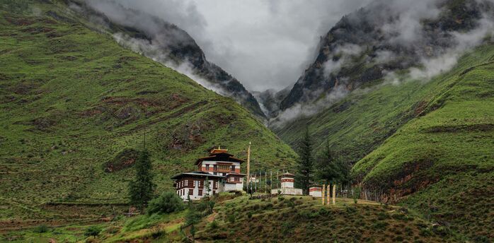 Bhutan mountain valley with traditional monastery buildings